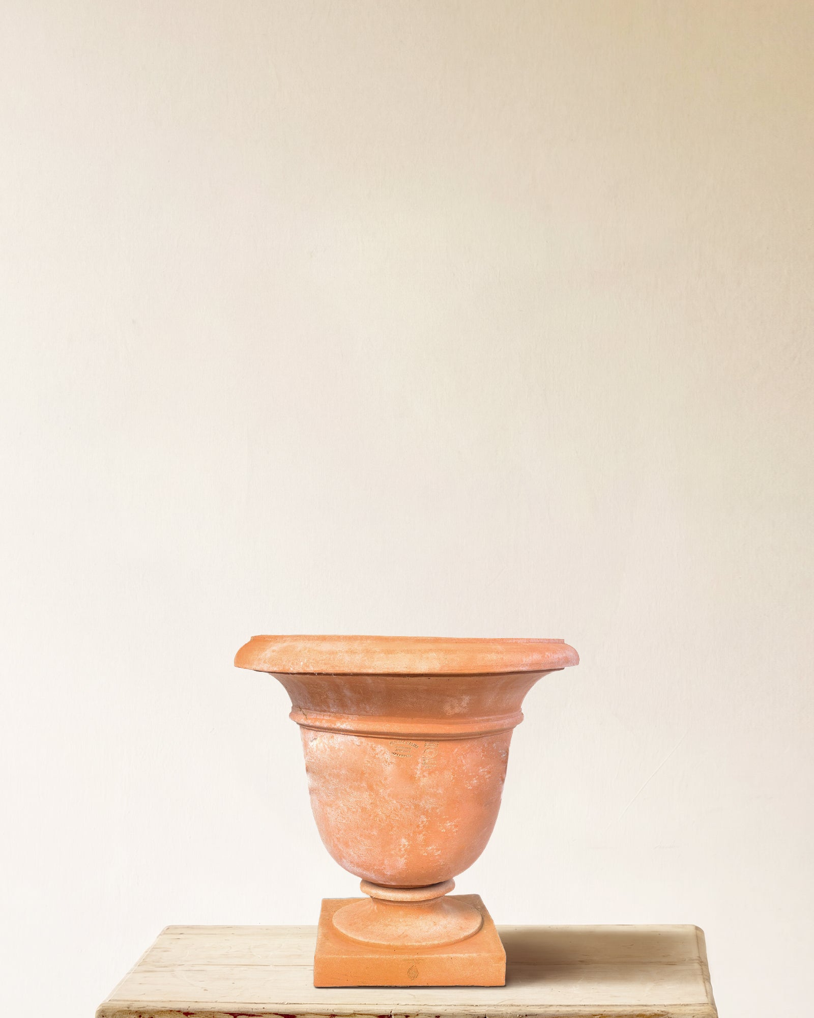 Italian terracotta campana urn with flared rim and square plinth base, made in Impruneta