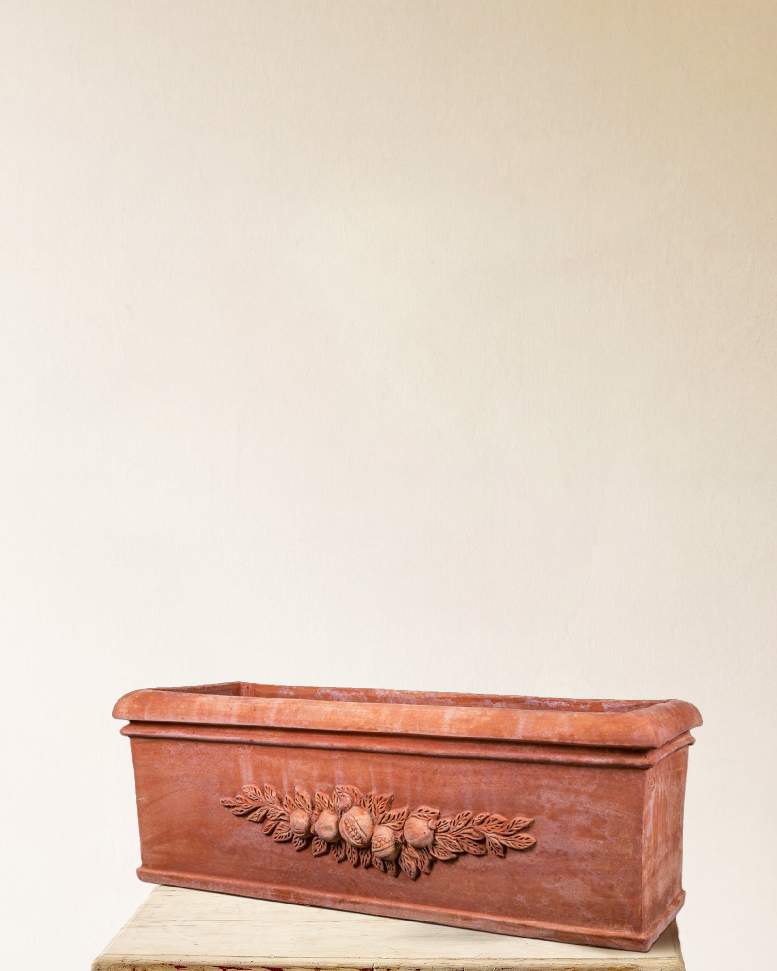 Italian terracotta rectangular planter with sculpted fruit garland relief, made in Impruneta, 35" x 12" x 15"