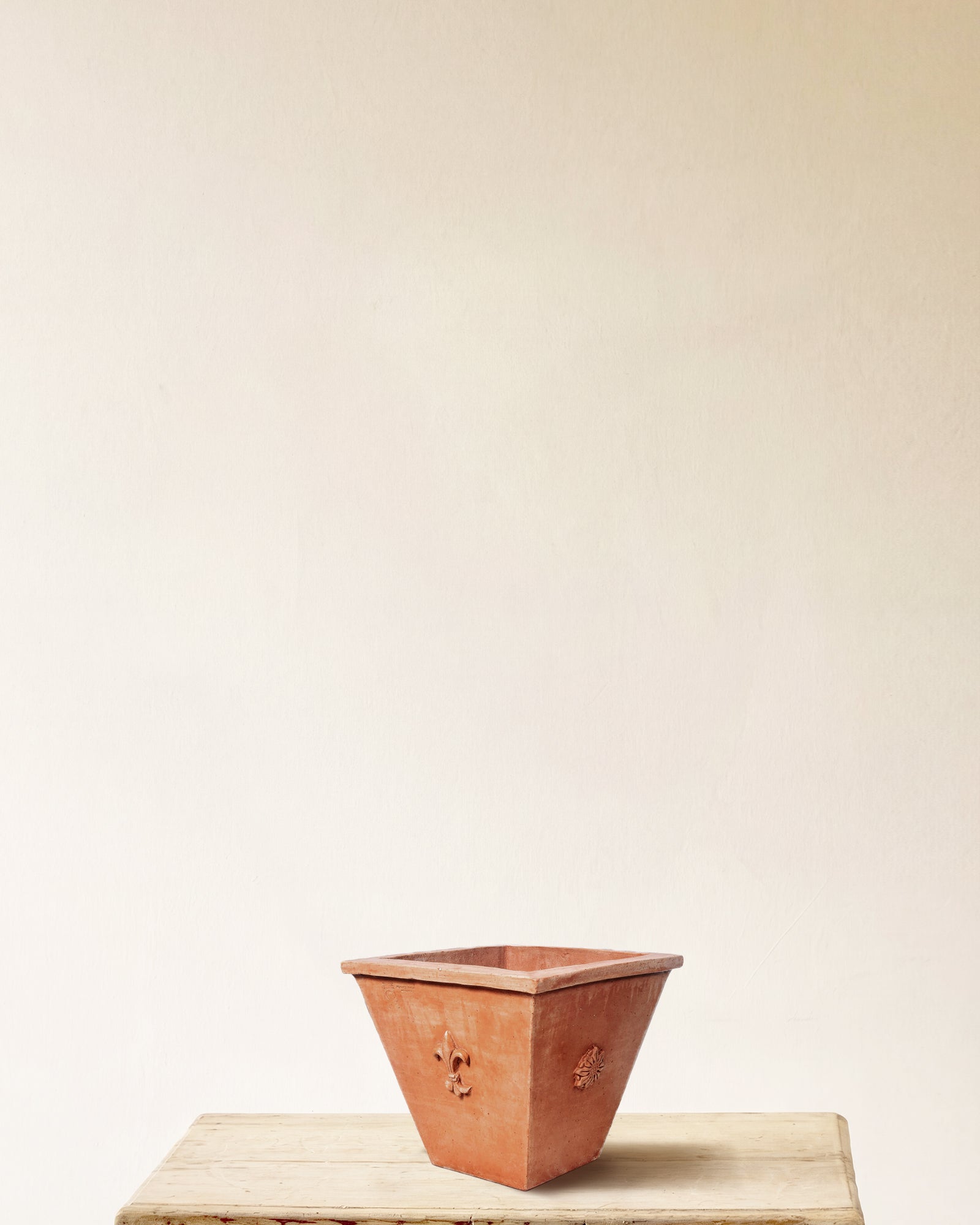 Italian terracotta planter, square flared form with embossed crest on each face, made in Impruneta, 13" x 11"