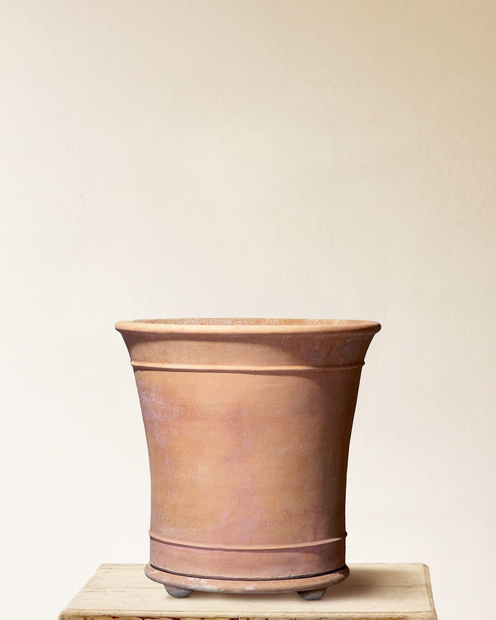 Italian terracotta planter with flared form and integrated feet, made in Impruneta, 26" x 30"