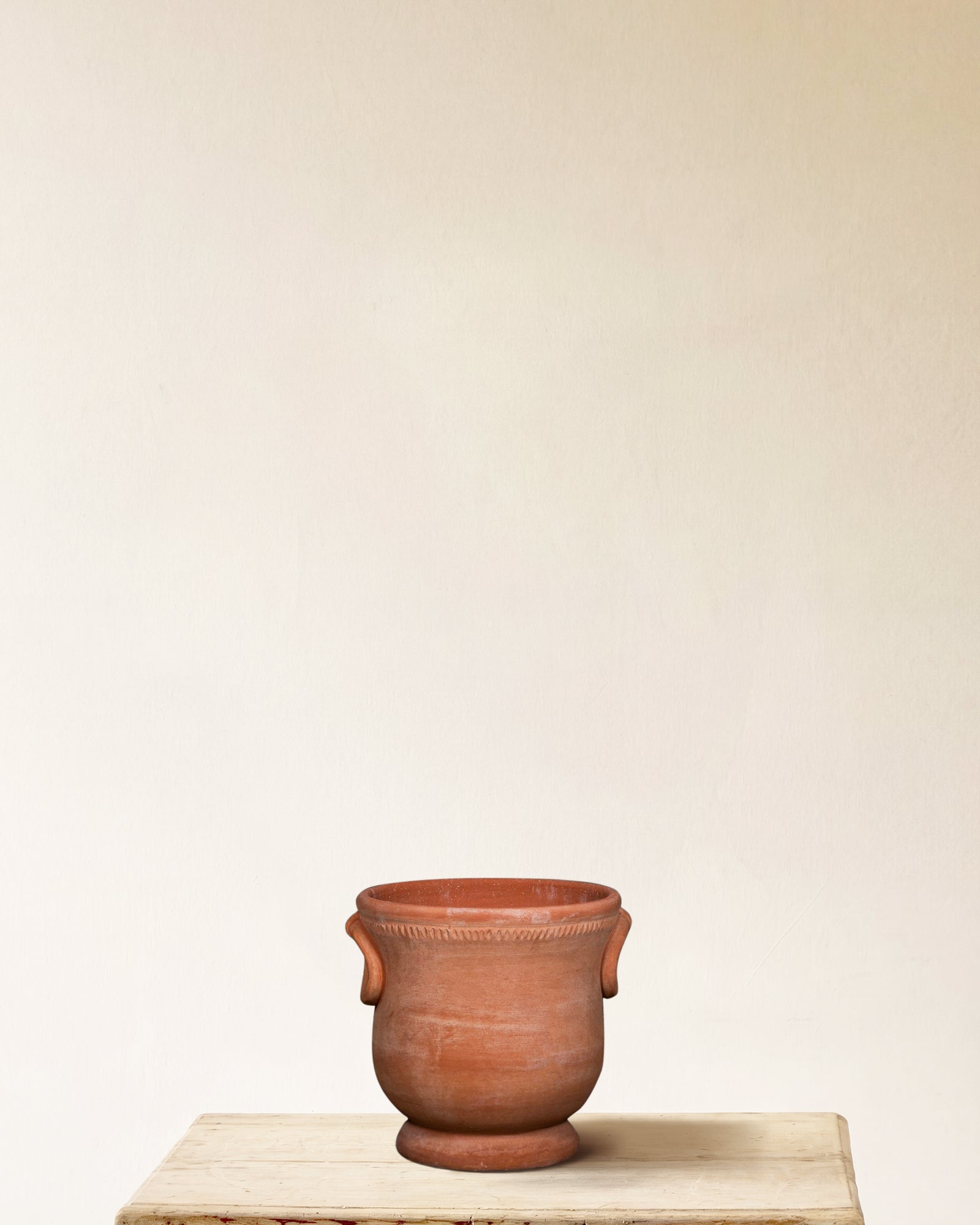 Italian terracotta planter with rounded body, flared base and ring handles, made in Impruneta, 13" x 15"
