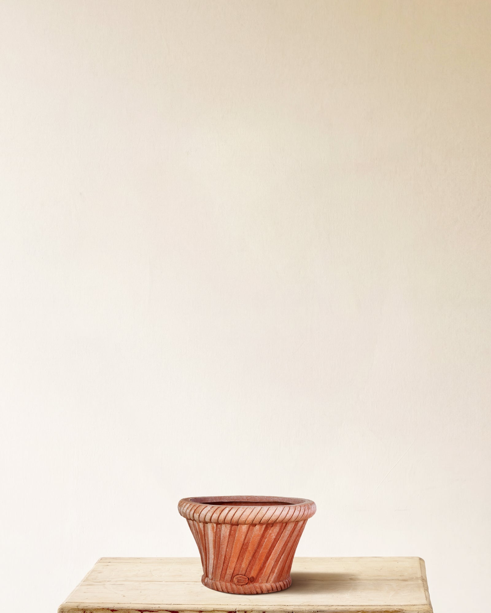 Italian terracotta planter with flared form and woven basket-weave relief, made in Impruneta, 12" x 9"