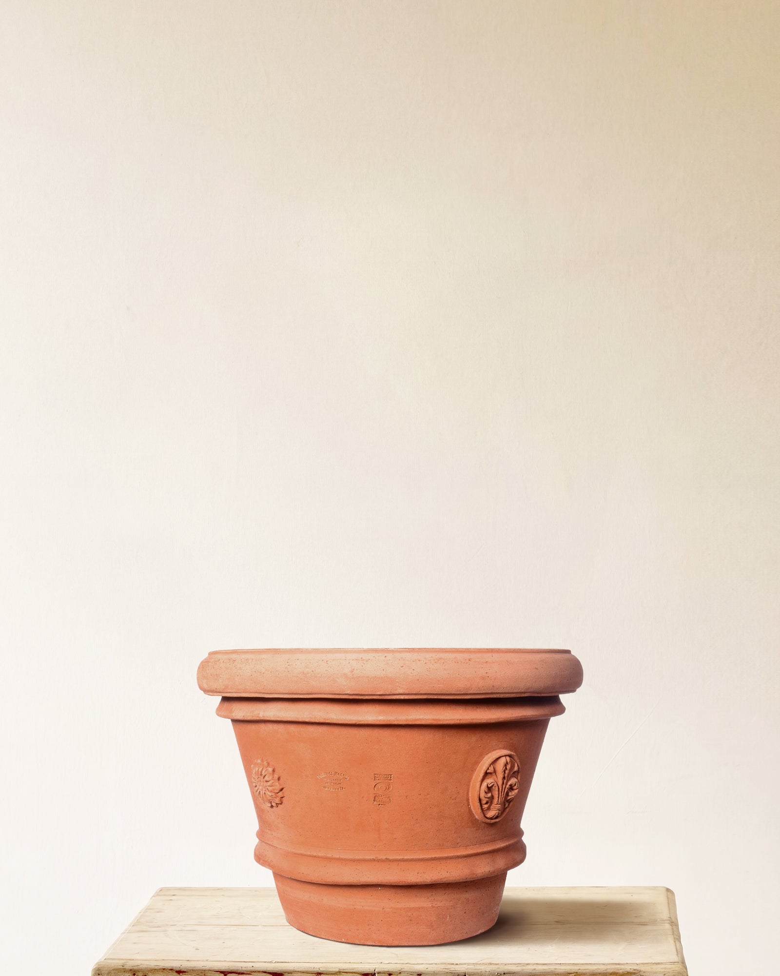 Italian terracotta planter with tapered form and embossed seal detailing, made in Impruneta, 24" x 21"