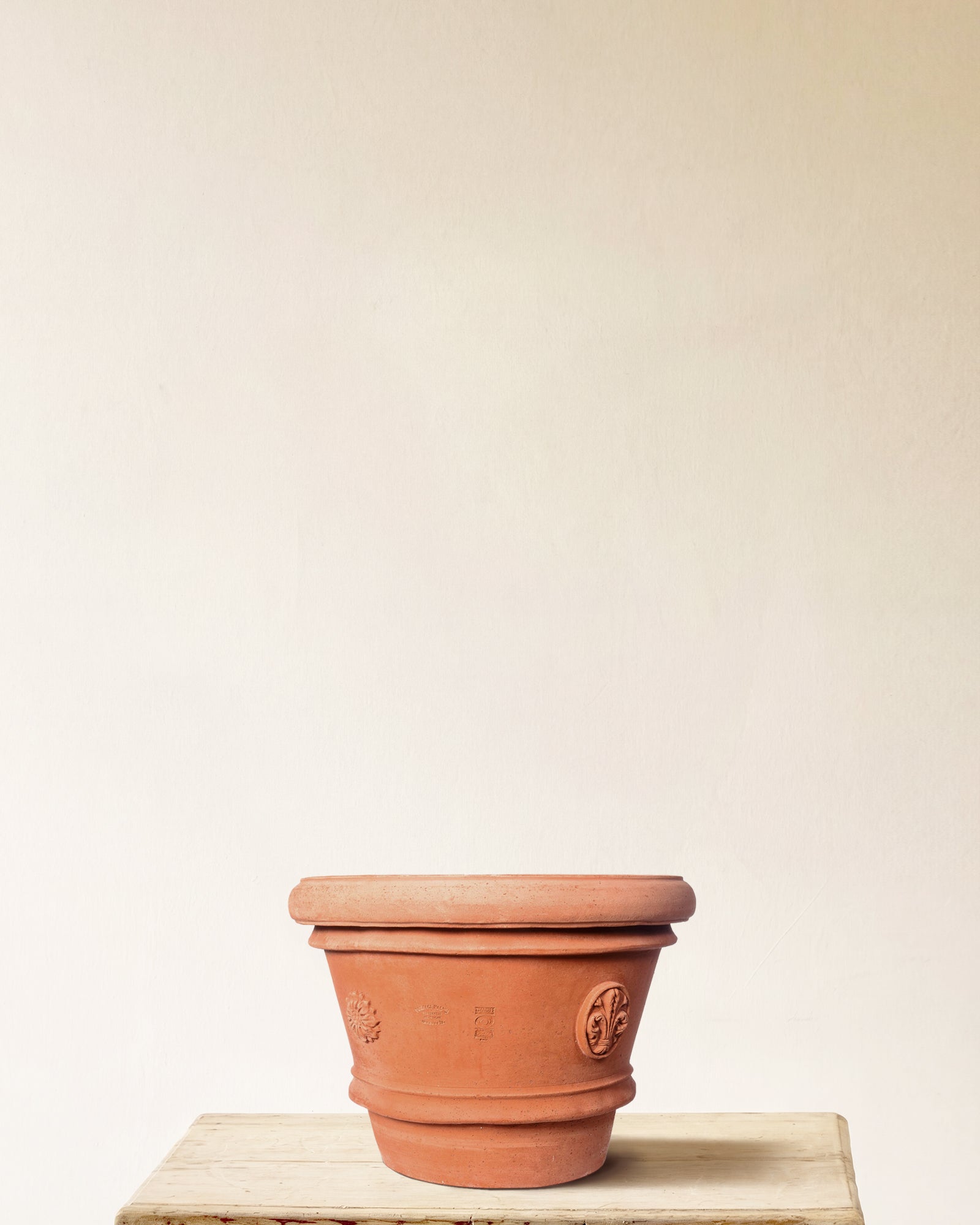 Italian terracotta planter with tapered form and embossed seal detailing, made in Impruneta, 20" x 17"