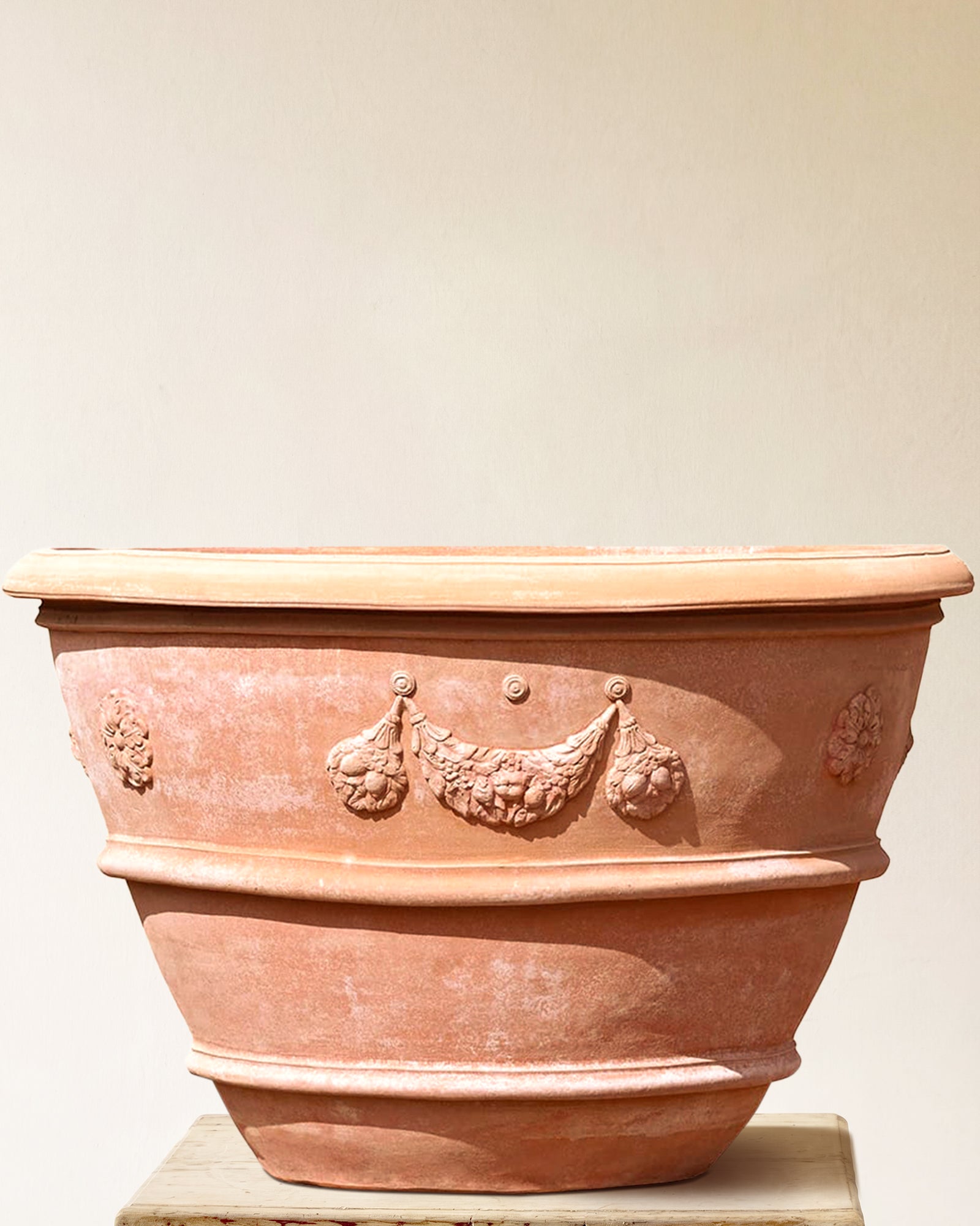 Italian terracotta planter with wide flared form and sculpted festoon band below rim, made in Impruneta, 51" x 38"