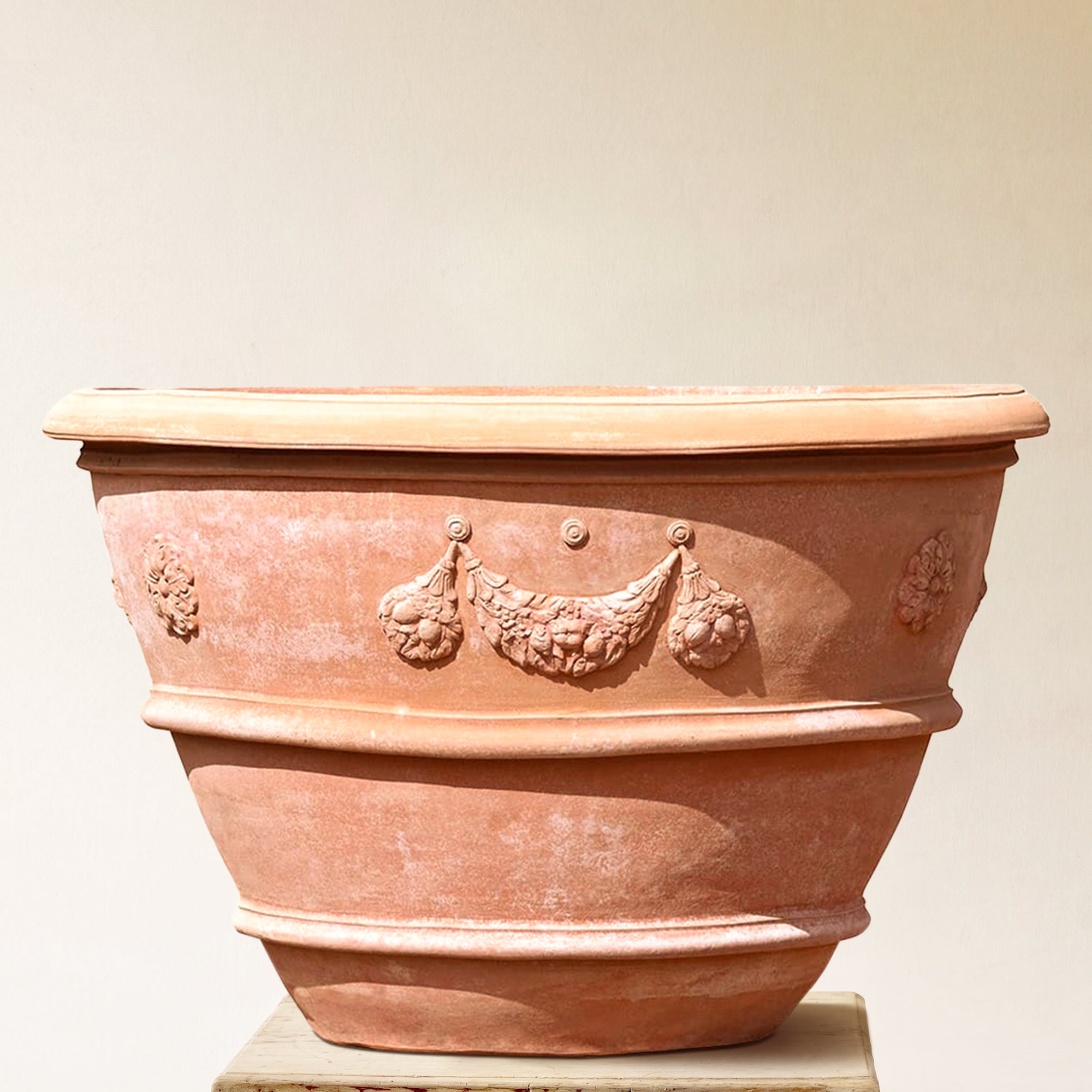 Italian terracotta planter with wide flared form and sculpted festoon band below rim, made in Impruneta, 55" x 39"