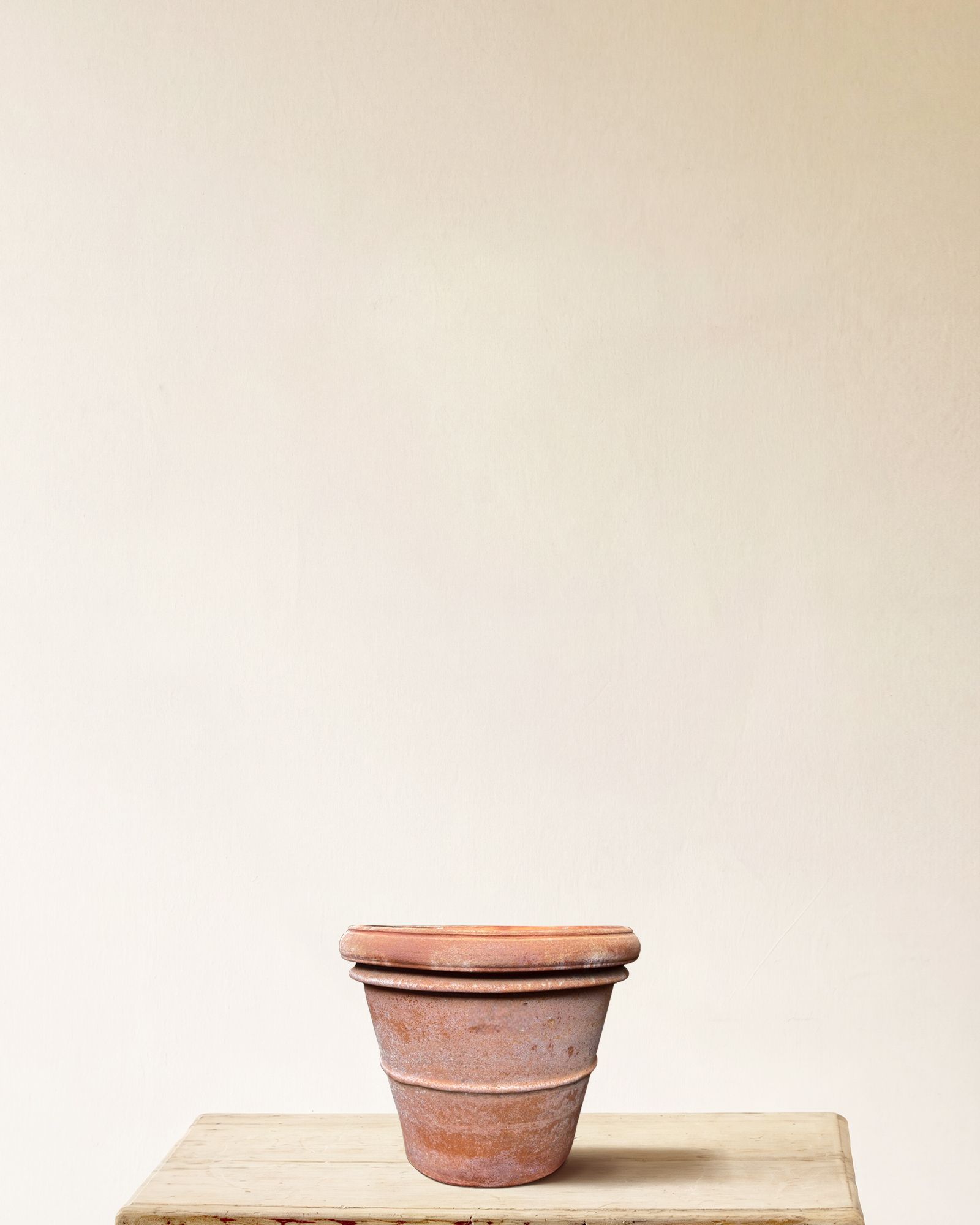 Italian terracotta planter with rounded form and wide rolled rim, smooth surface, made in Impruneta, 14" x 12"
