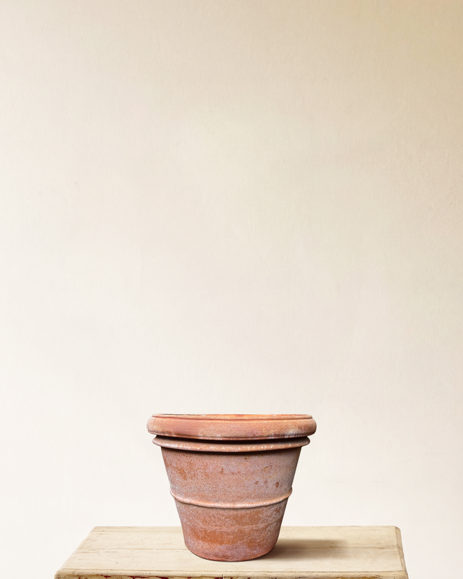 Italian terracotta planter with rounded form and wide rolled rim, smooth surface, made in Impruneta, 16" x 13"