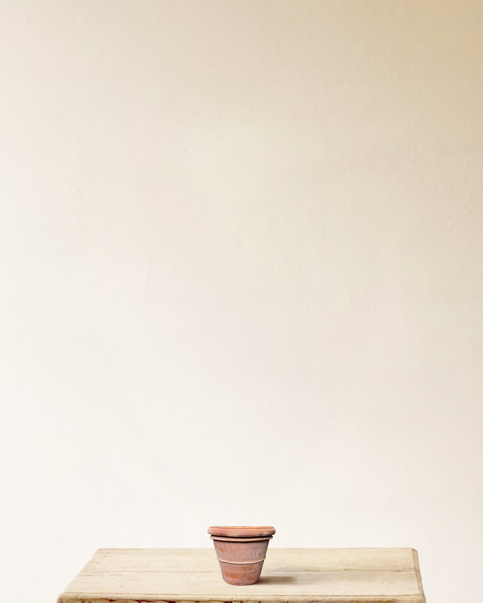 Italian terracotta planter with rounded form and wide rolled rim, smooth surface, made in Impruneta, 6" x 6"