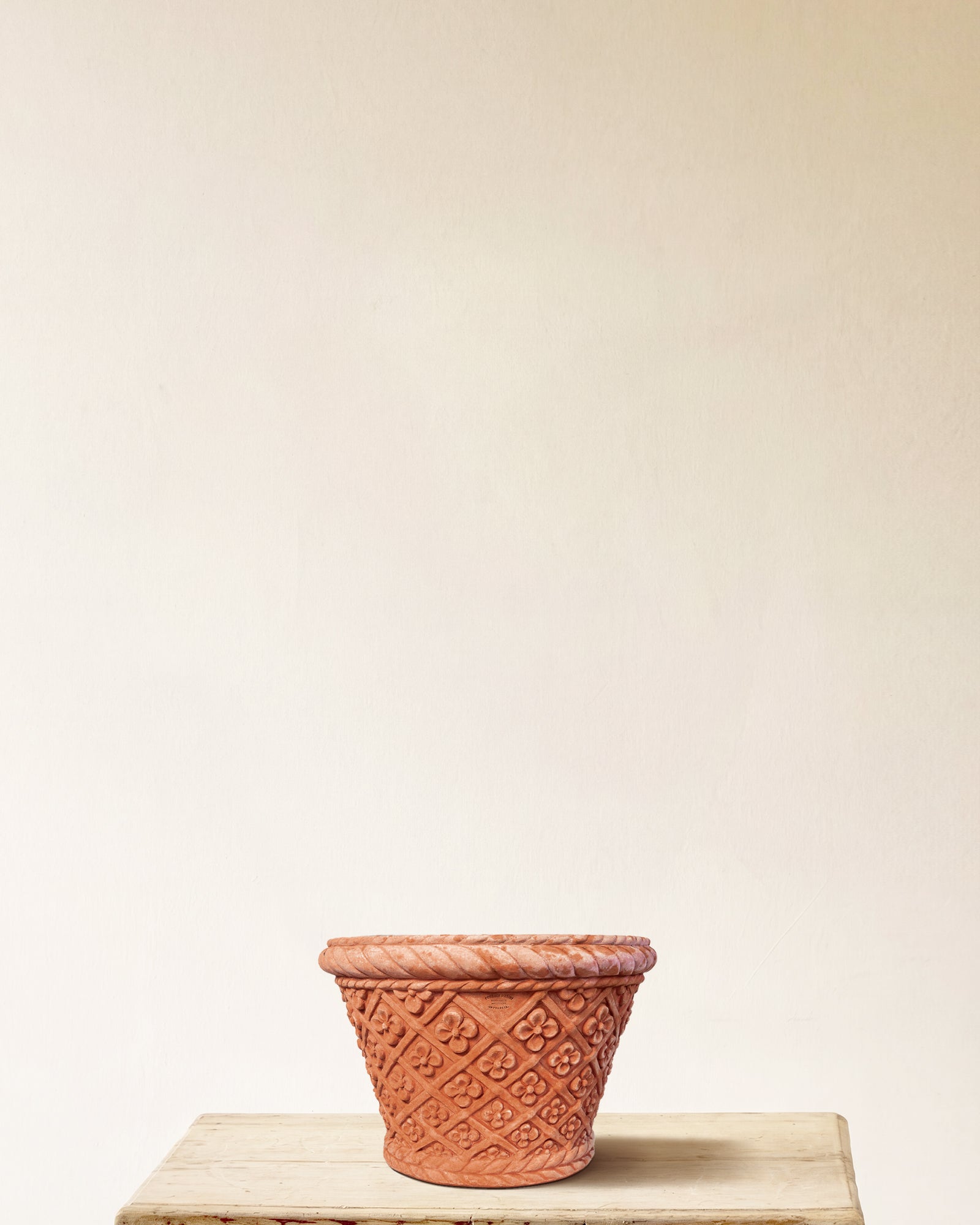 Italian terracotta planter with conical form and carved daisy lattice, made in Impruneta, 17" x 14"
