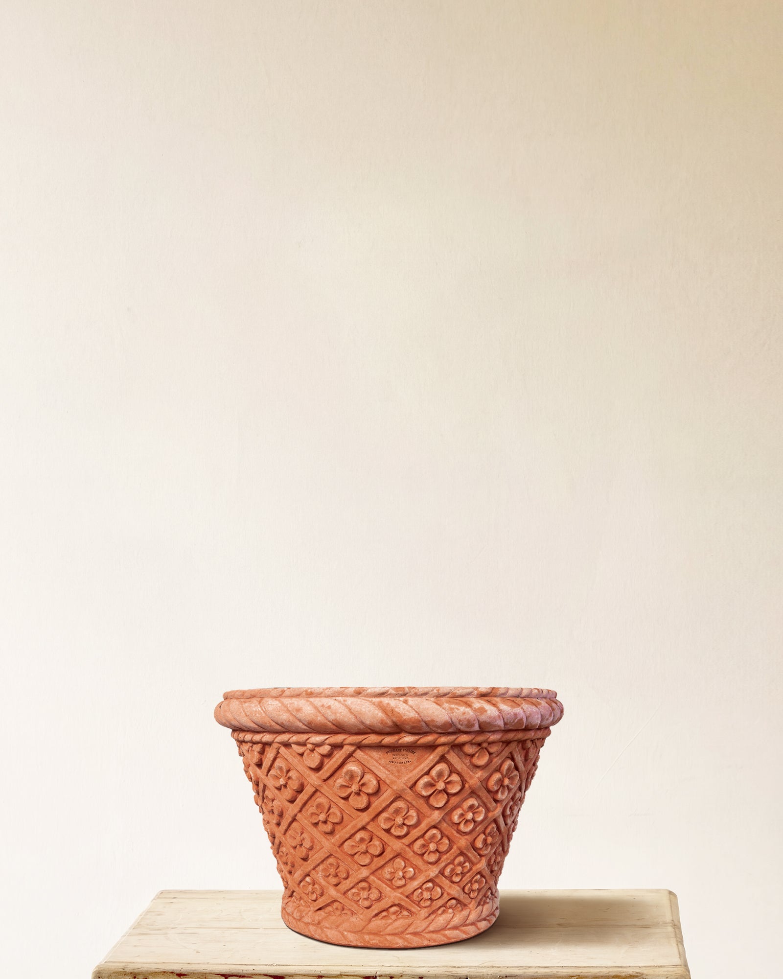 Italian terracotta planter with conical form and carved daisy lattice, made in Impruneta, 22" x 17"