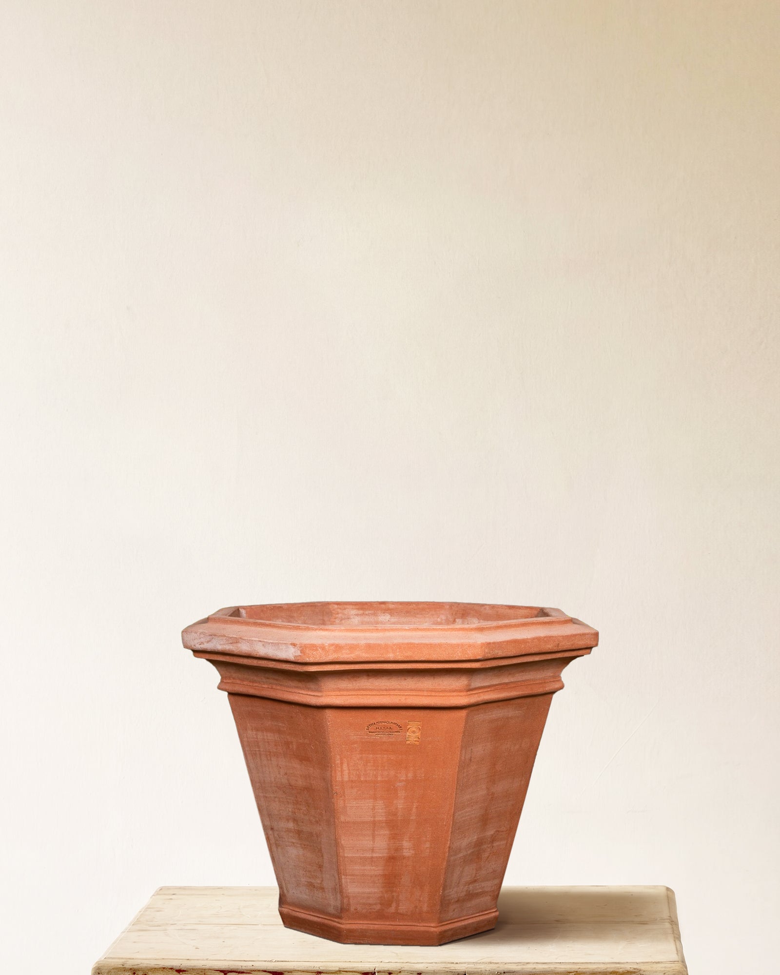 Italian terracotta planter with eight-sided faceted form and flared profile, made in Impruneta, 21" x 22"