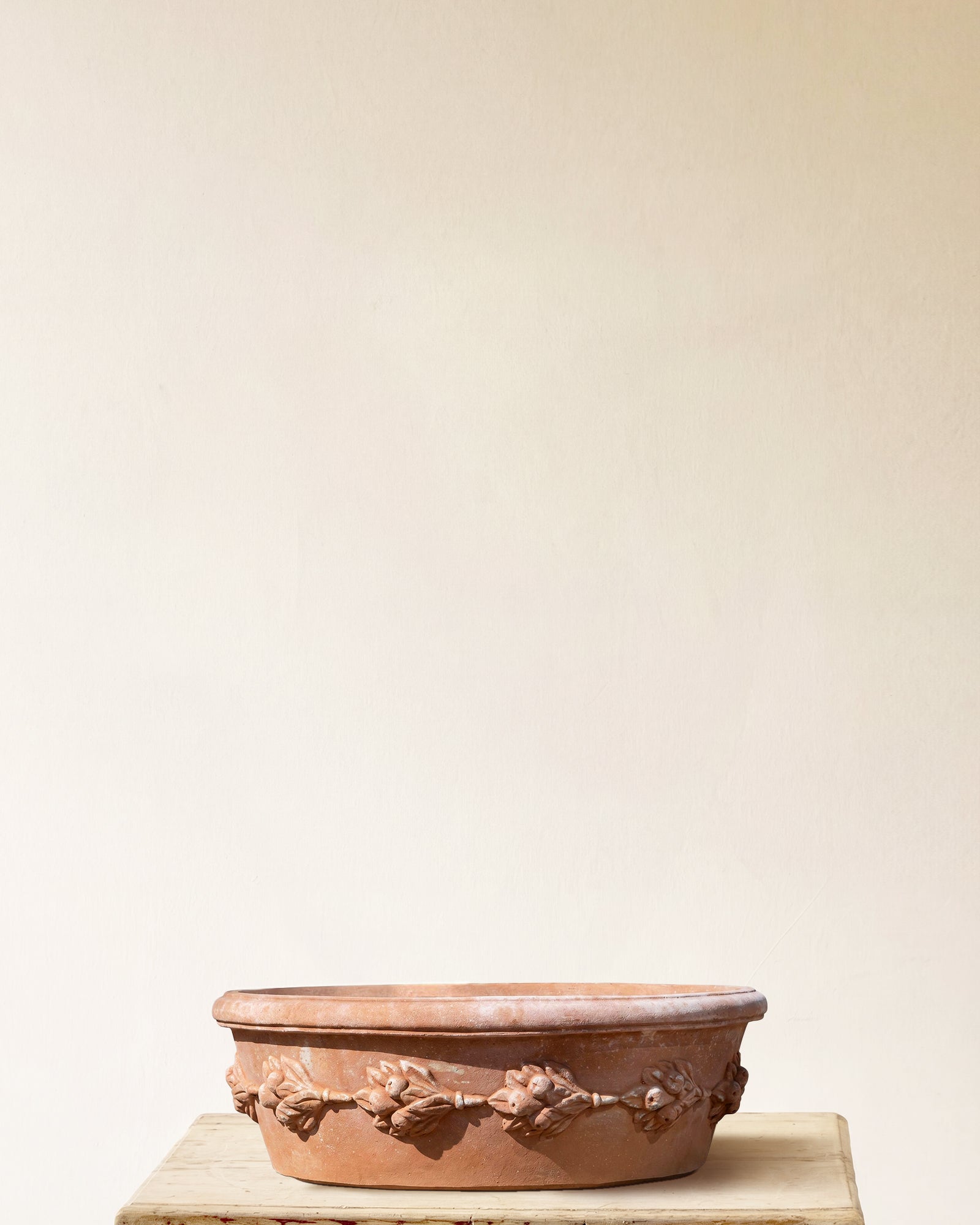 Italian terracotta oval planter with low profile and sculpted garland band, made in Impruneta, 24" x 9"