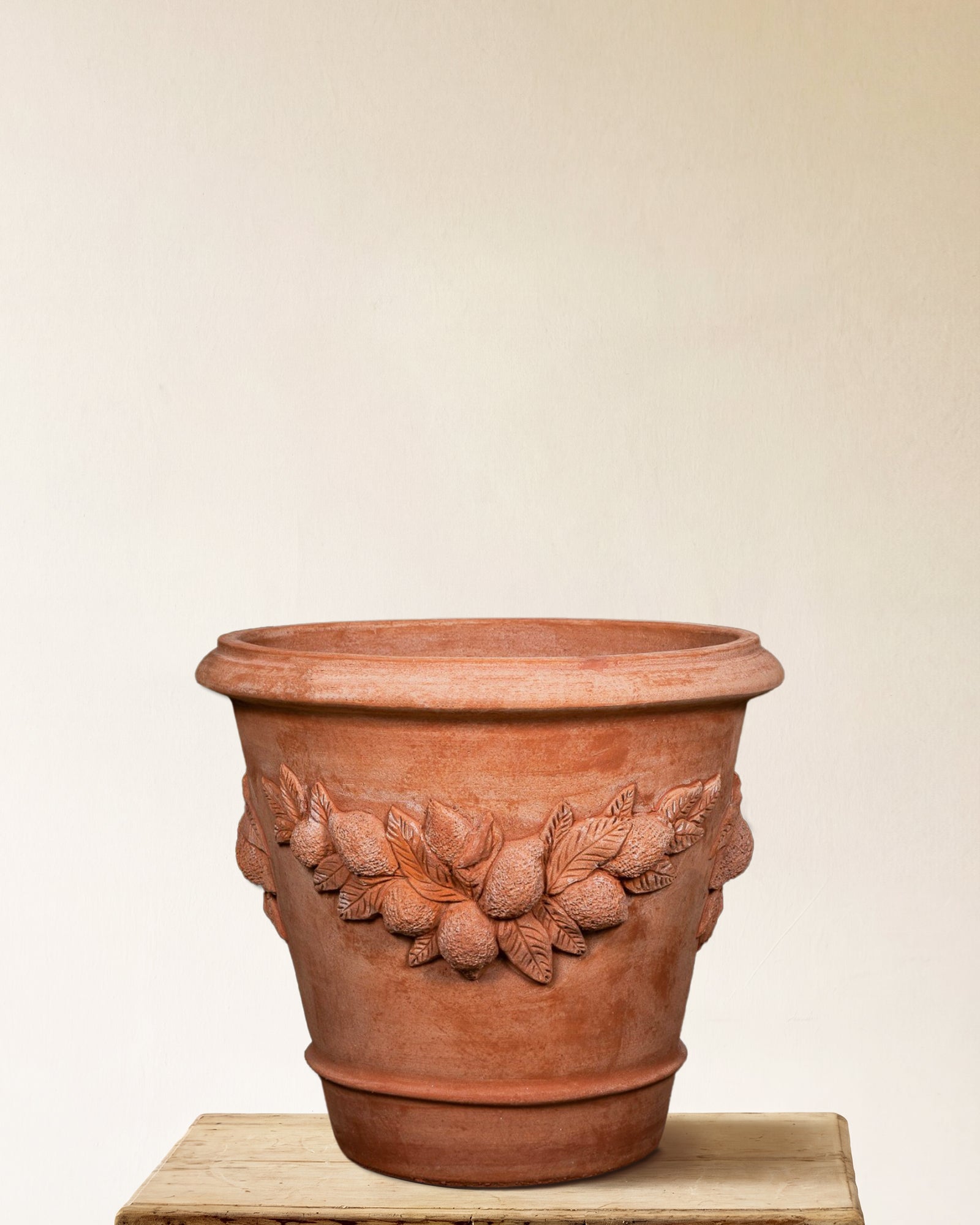 Italian terracotta planter with sculpted lemon and leaf relief band, made in Impruneta, Large