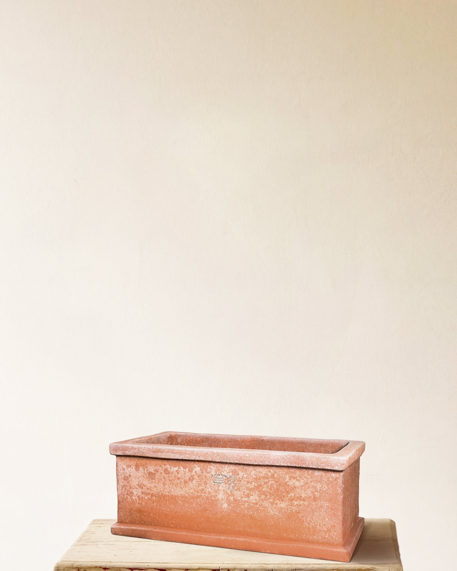 Italian terracotta rectangular planter with raised base and defined rim, made in Impruneta, 24" x 9"