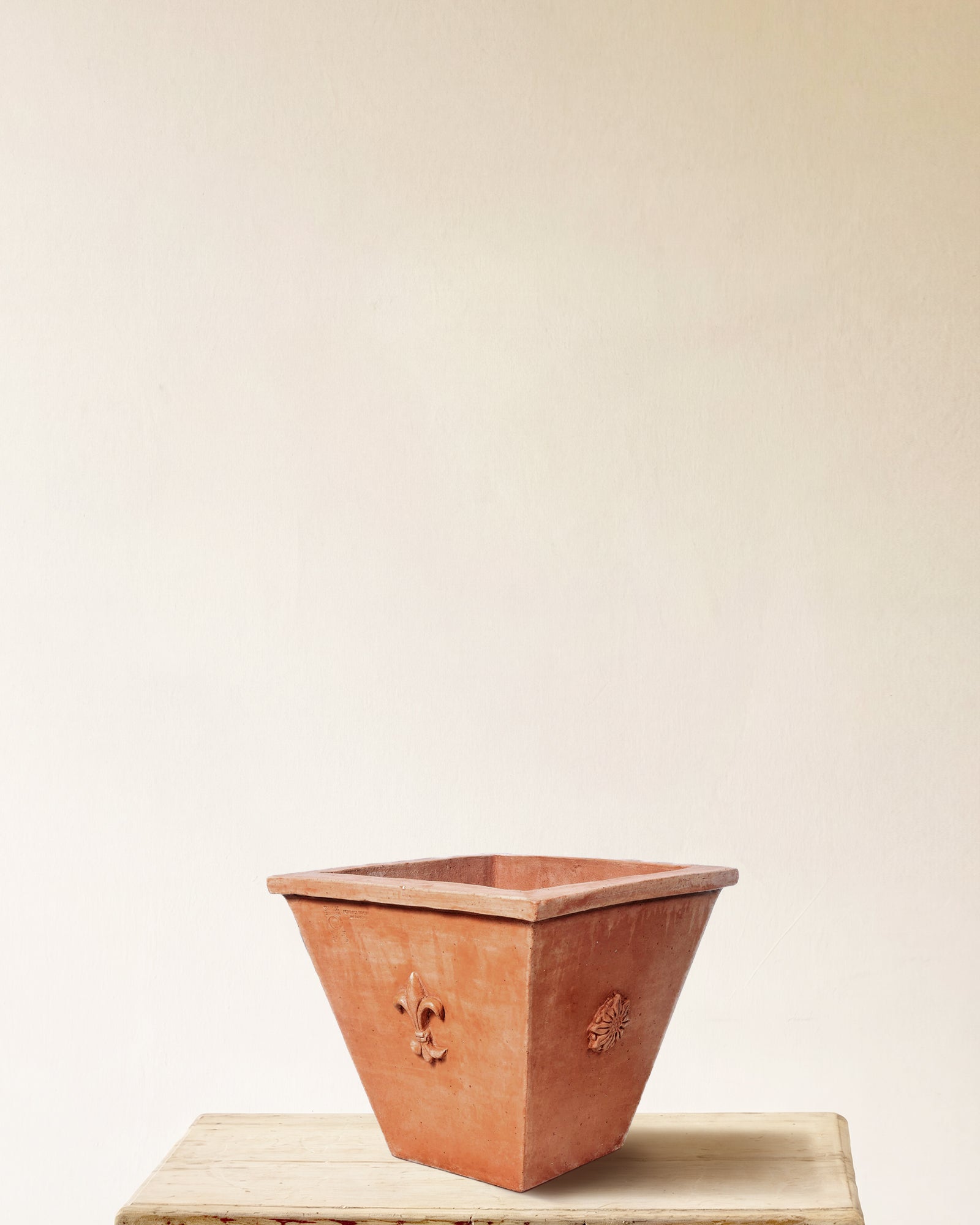 Italian terracotta planter, square flared form with embossed crest on each face, made in Impruneta, 18" x 15"