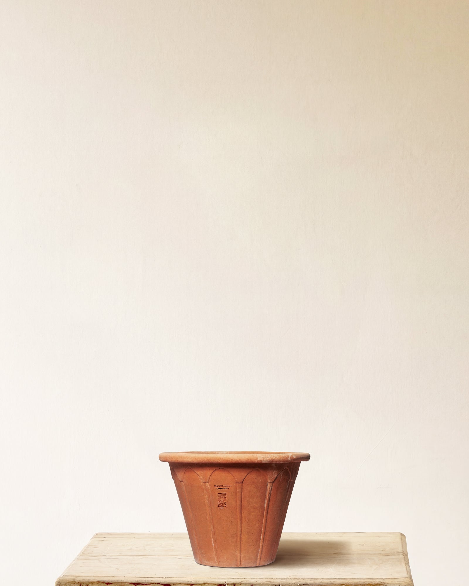 Italian terracotta planter with flared form and vertical fluting, made in Impruneta, 13" x 12"