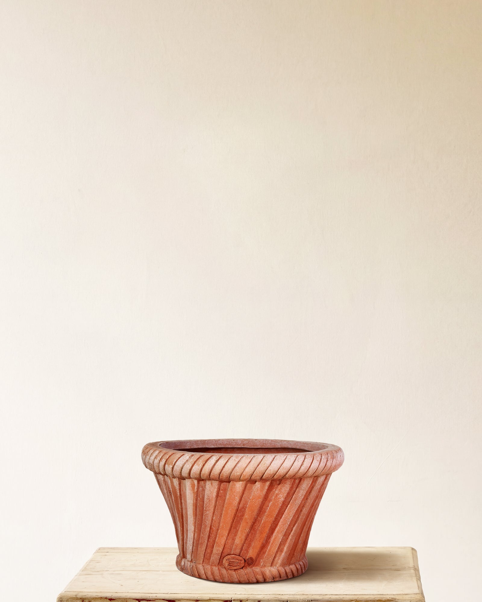 Italian terracotta planter with flared form and woven basket-weave relief, made in Impruneta, 18" x 15"