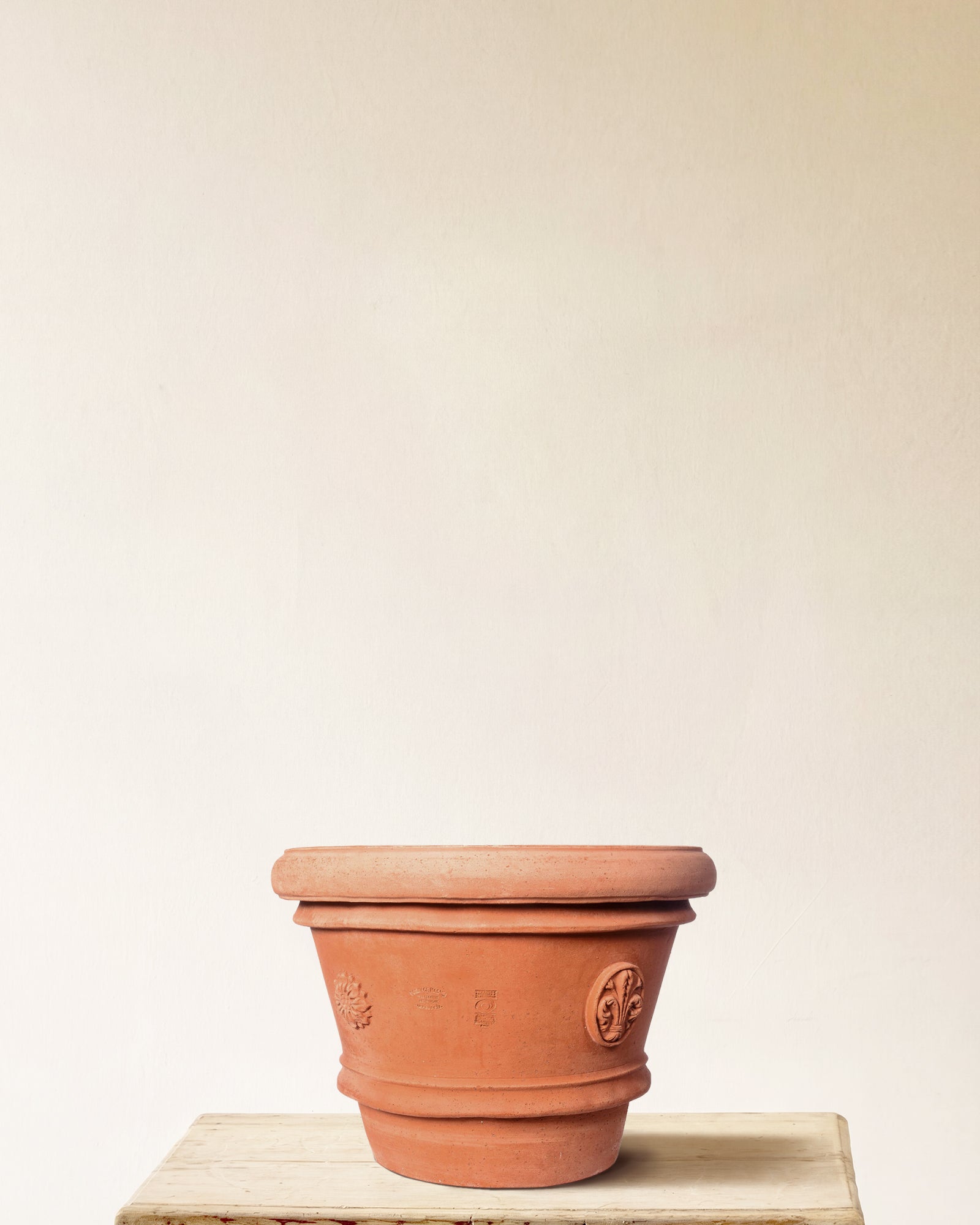 Italian terracotta planter with tapered form and embossed seal detailing, made in Impruneta, 22" x 19"