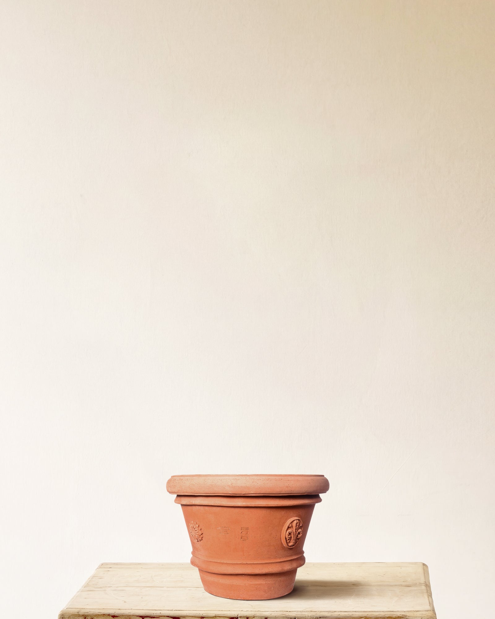 Italian terracotta planter with tapered form and embossed seal detailing, made in Impruneta, 16" x 13"