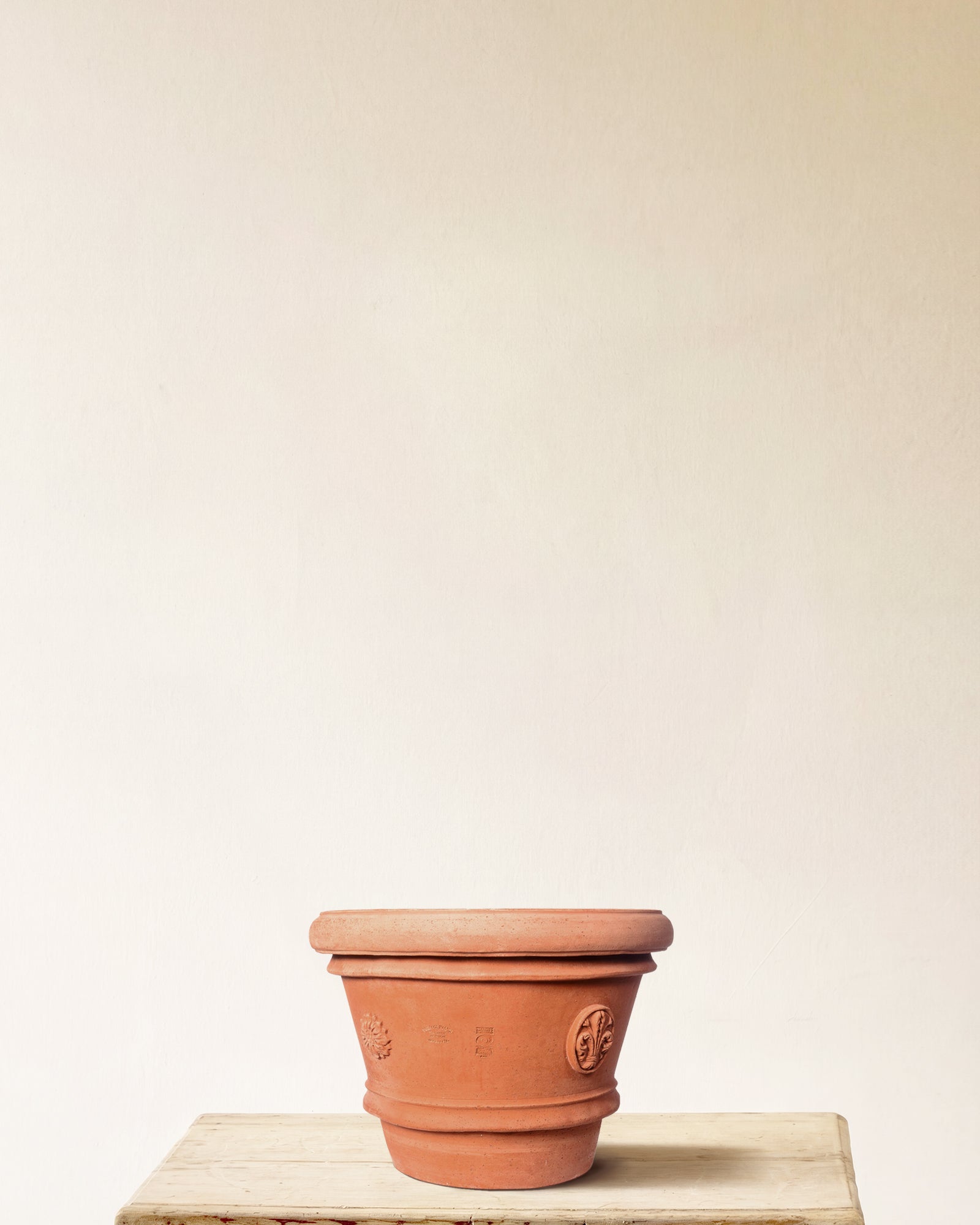 Italian terracotta planter with tapered form and embossed seal detailing, made in Impruneta, 18" x 15"