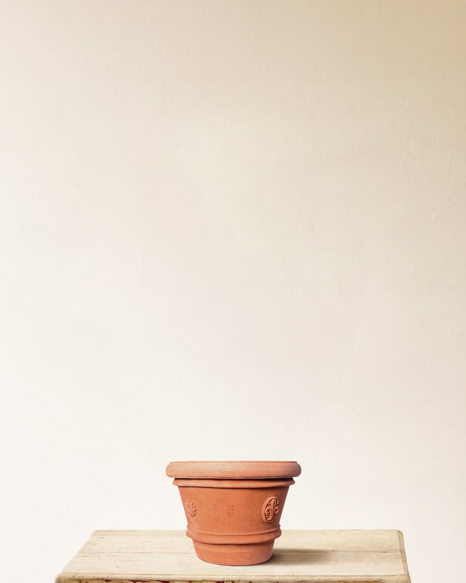 Italian terracotta planter with tapered form and embossed seal detailing, made in Impruneta, 14" x 13"