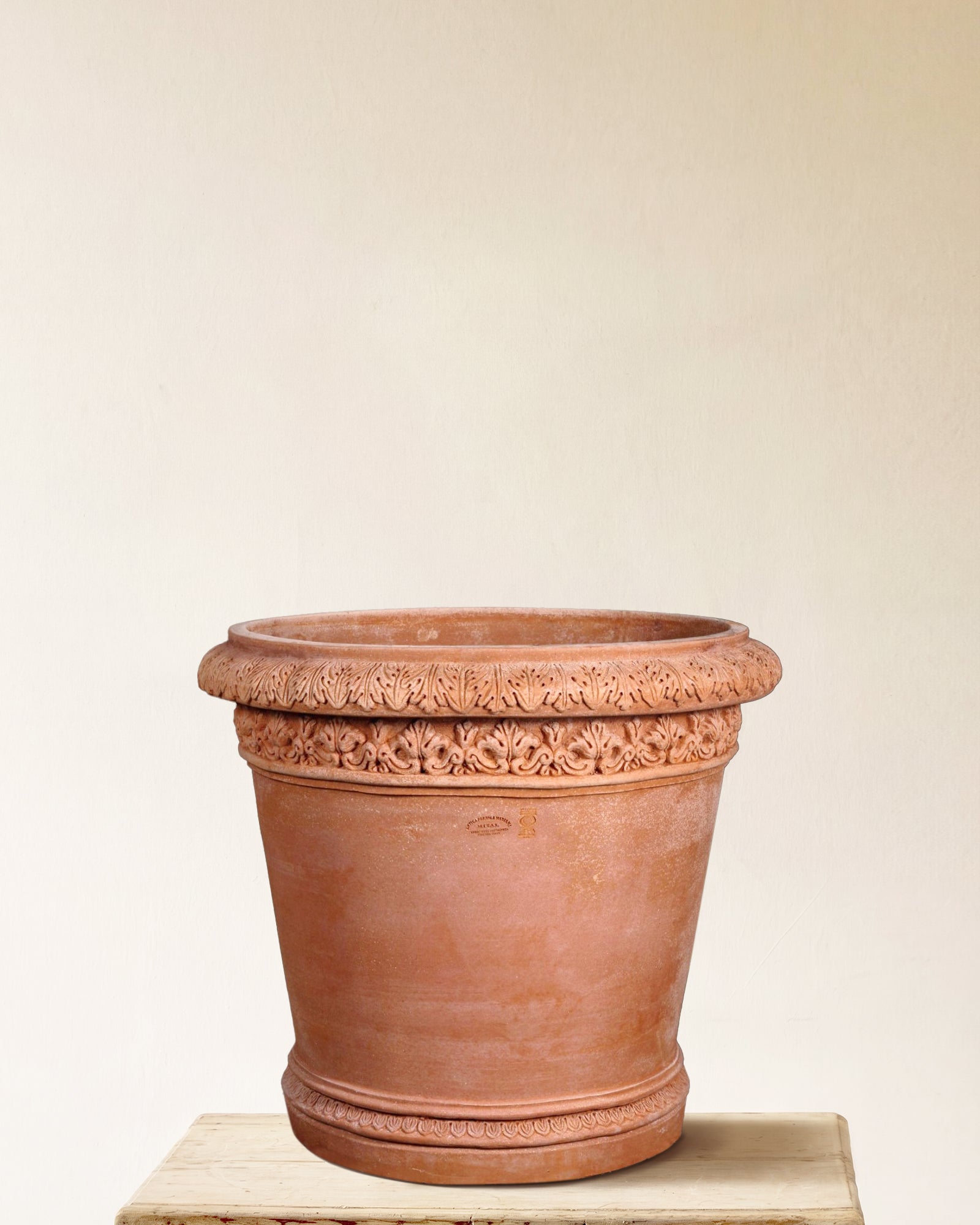 Italian terracotta planter with stylized foliage band beneath rolled rim, made in Impruneta