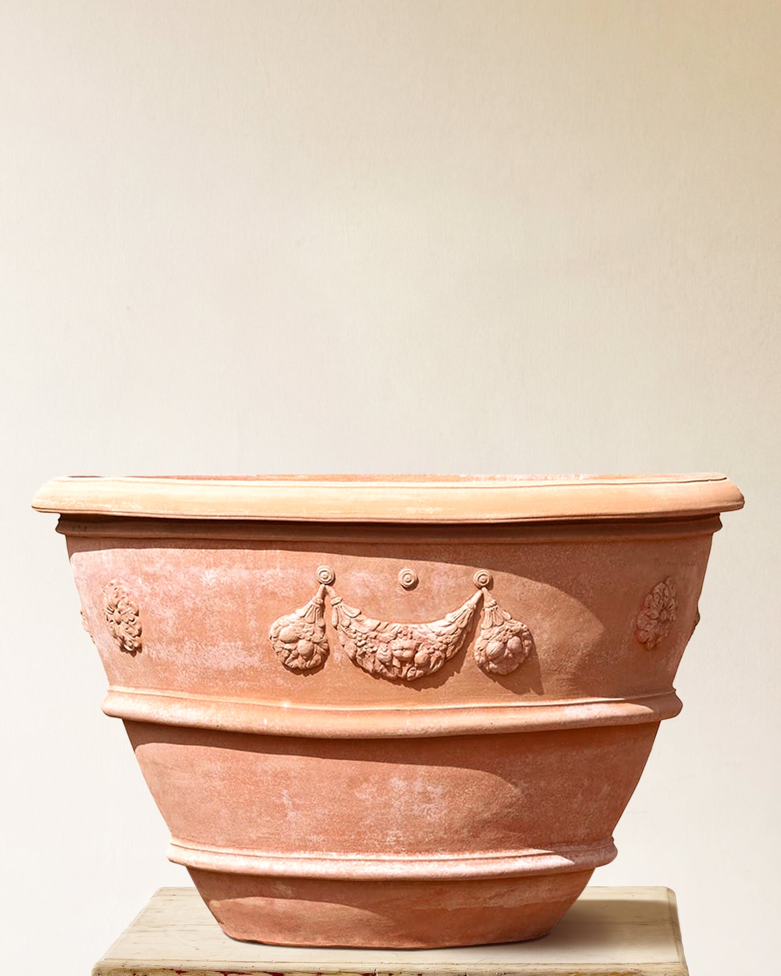 Italian terracotta planter with wide flared form and sculpted festoon band below rim, made in Impruneta, 43" x 32"