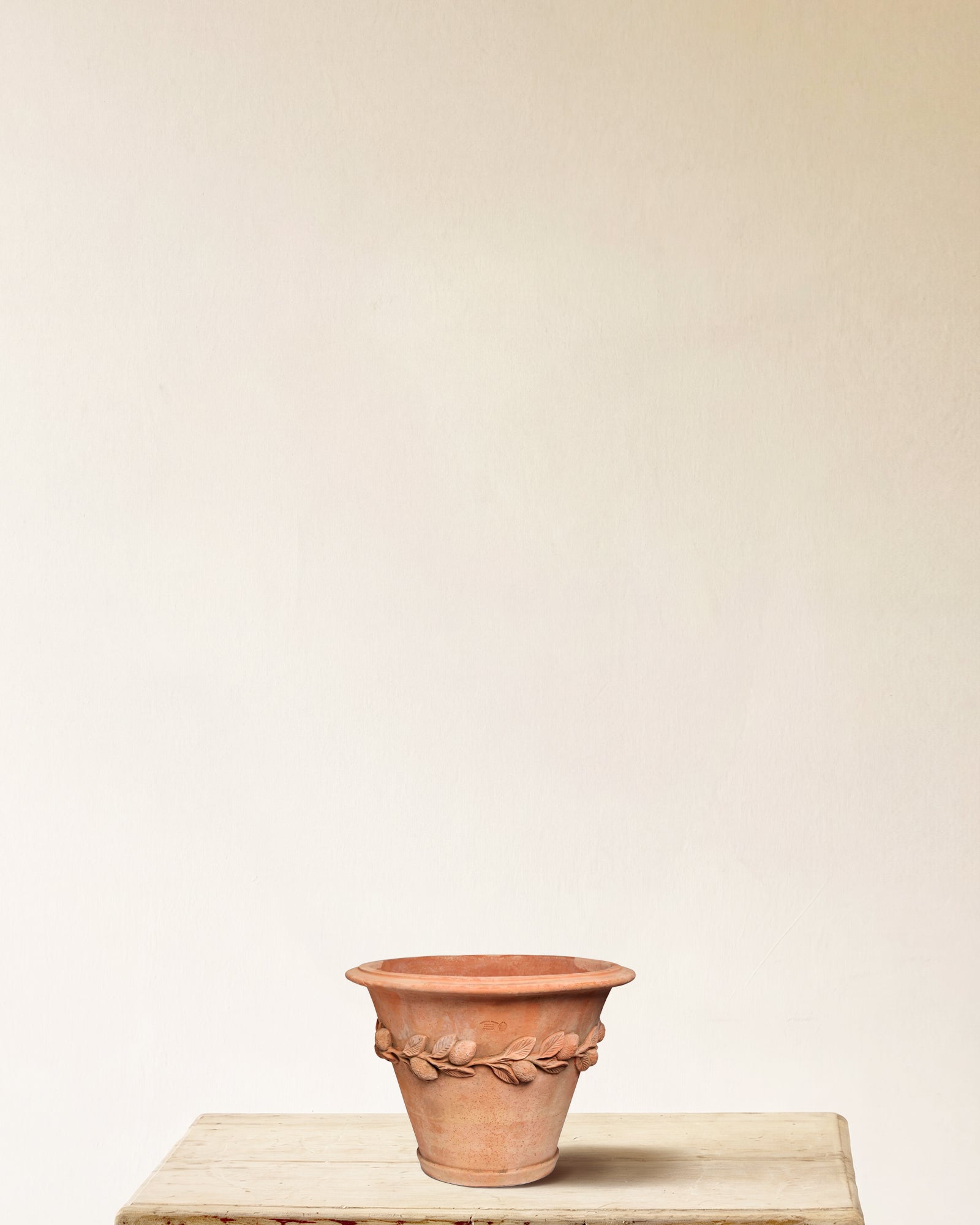 Italian terracotta planter with flared form and sculpted lemon and leaf band, made in Impruneta, 13" x 13"