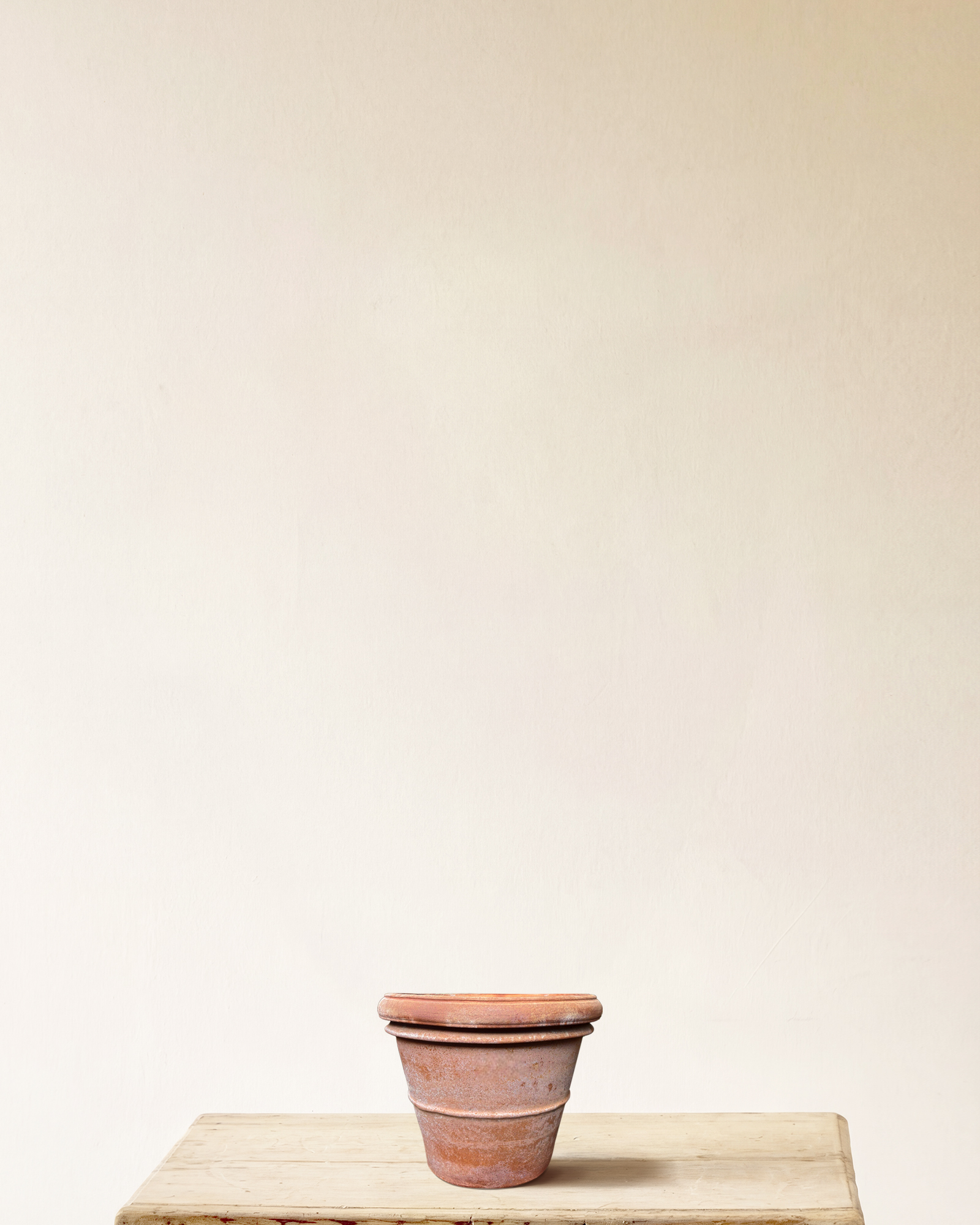 Italian terracotta planter with rounded form and wide rolled rim, smooth surface, made in Impruneta, 10" x 9"