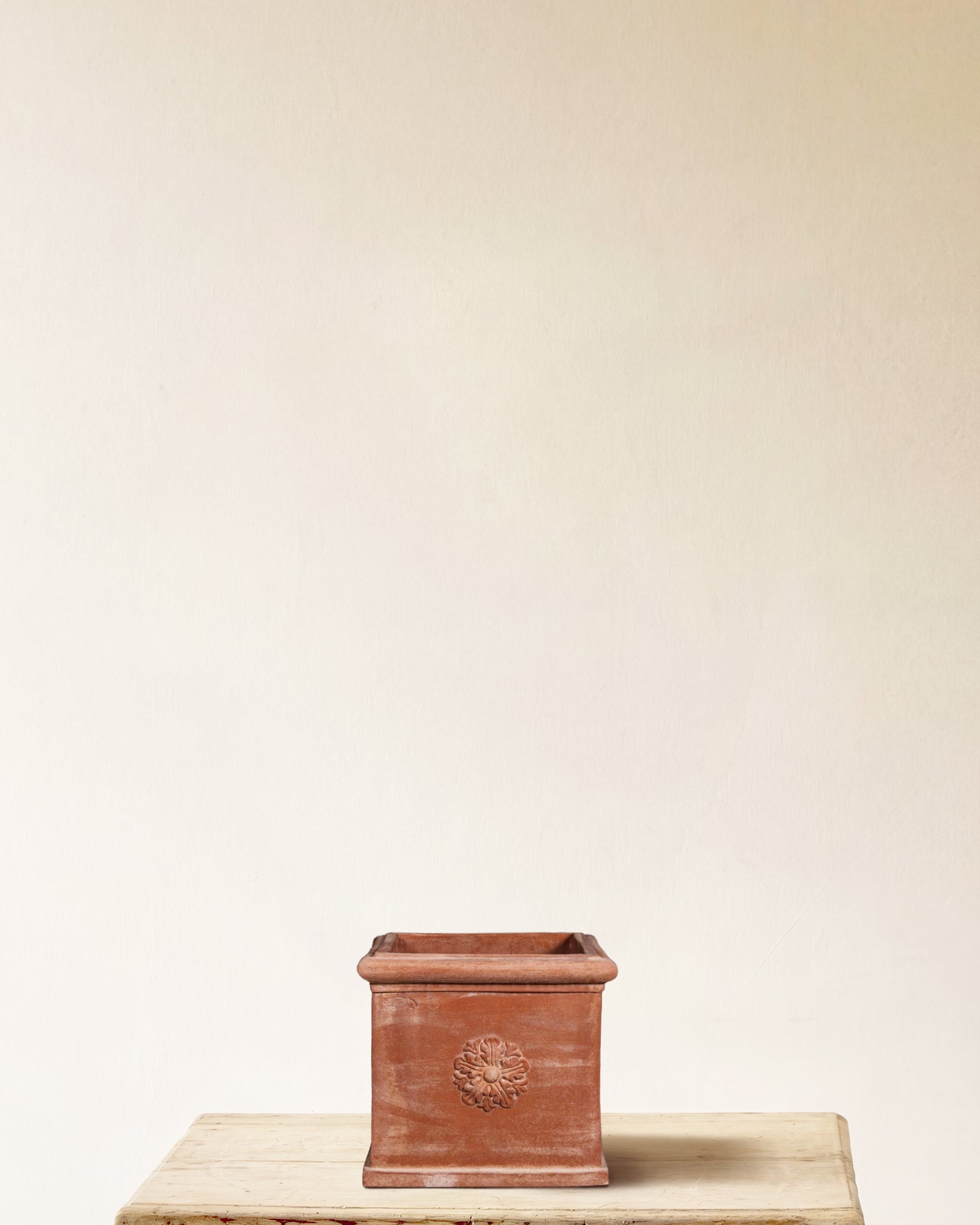 Italian terracotta square planter with carved rosette on each face, made in Impruneta, 15" x 13"